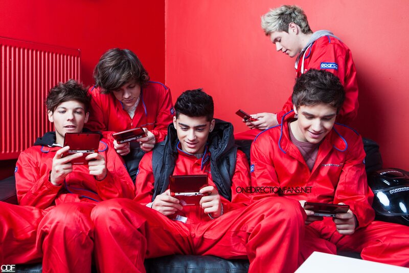 One Direction in red jumpsuits