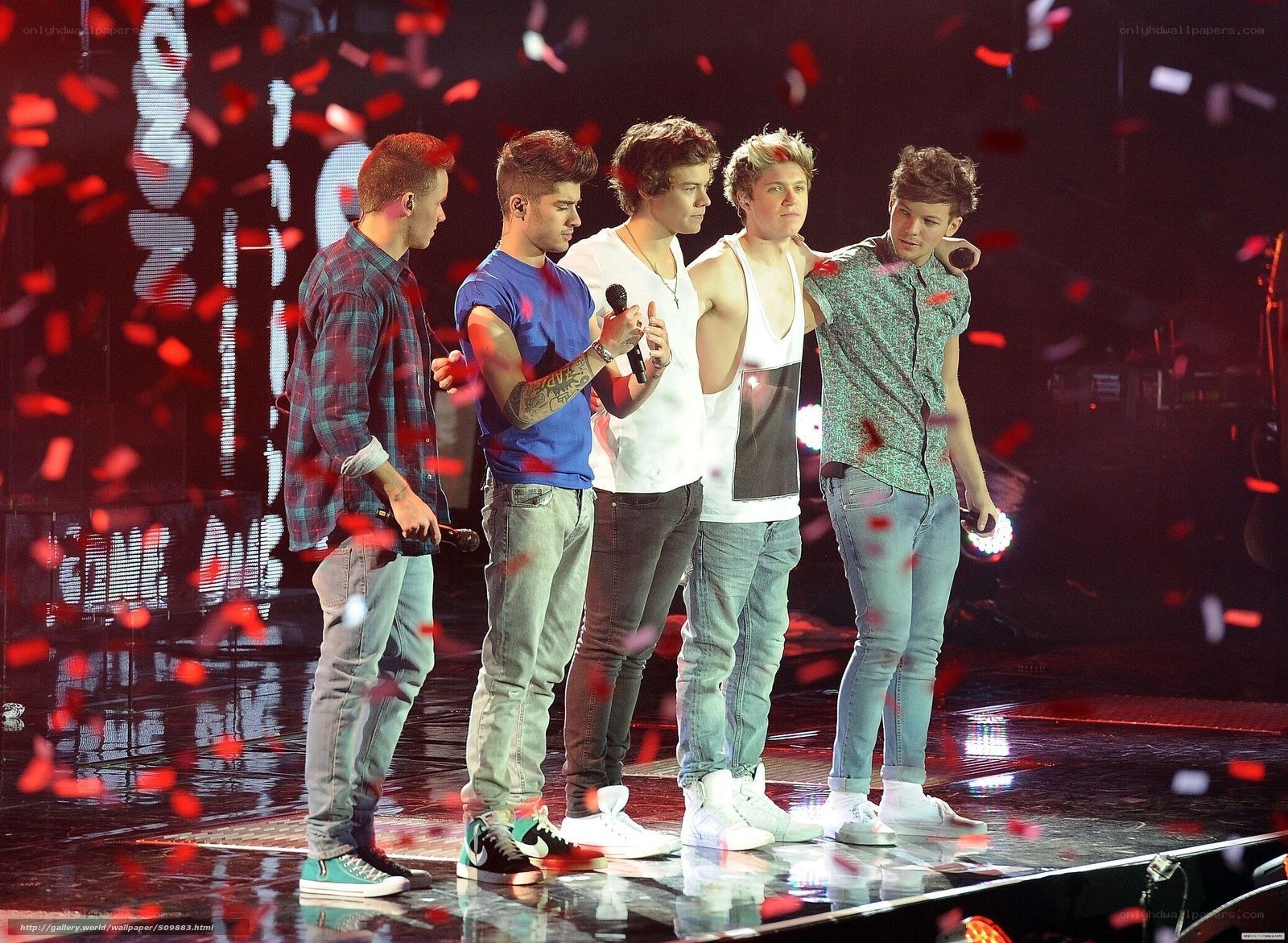 One Direction on stage with confetti