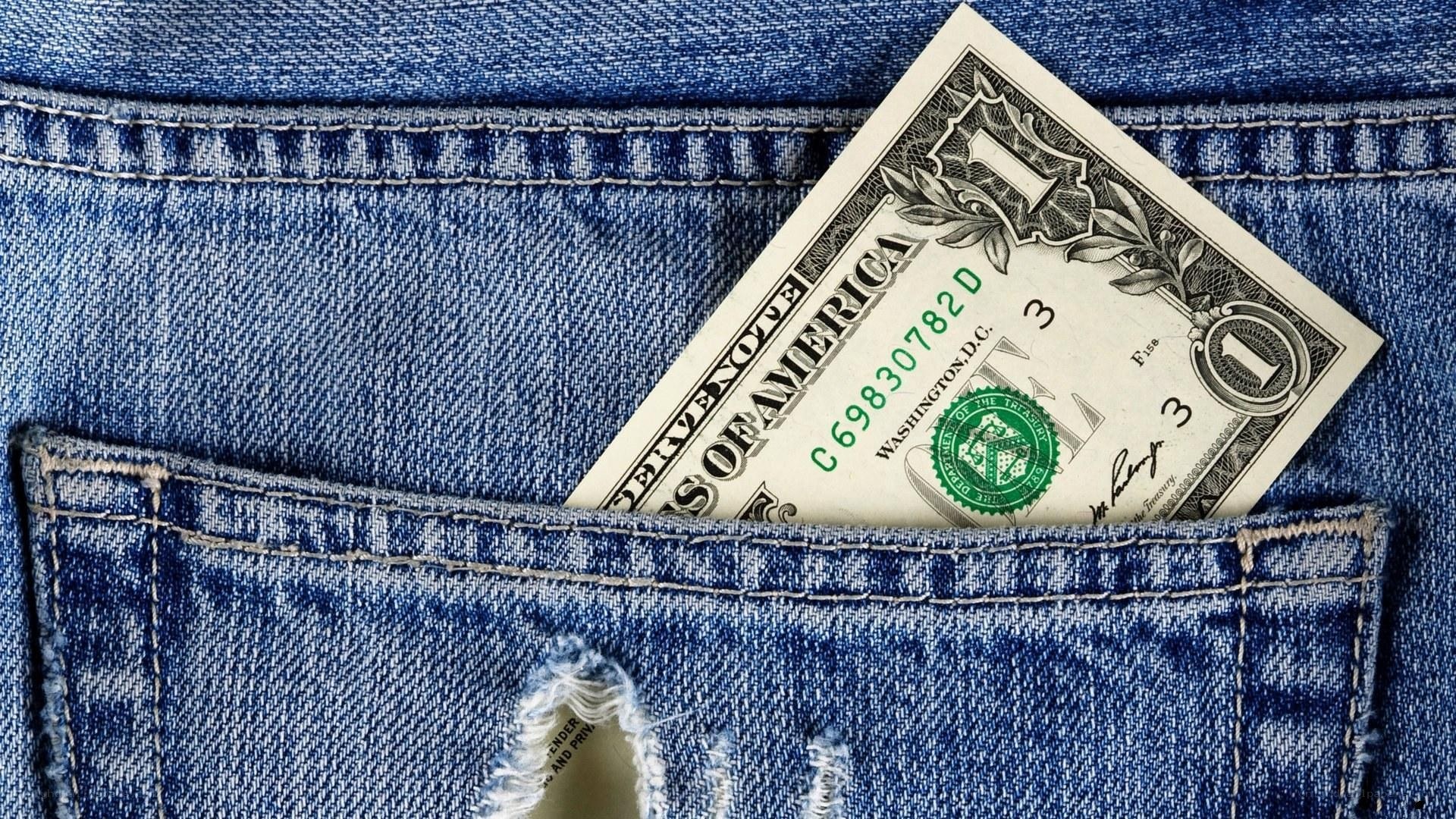 One dollar bill in jeans pocket