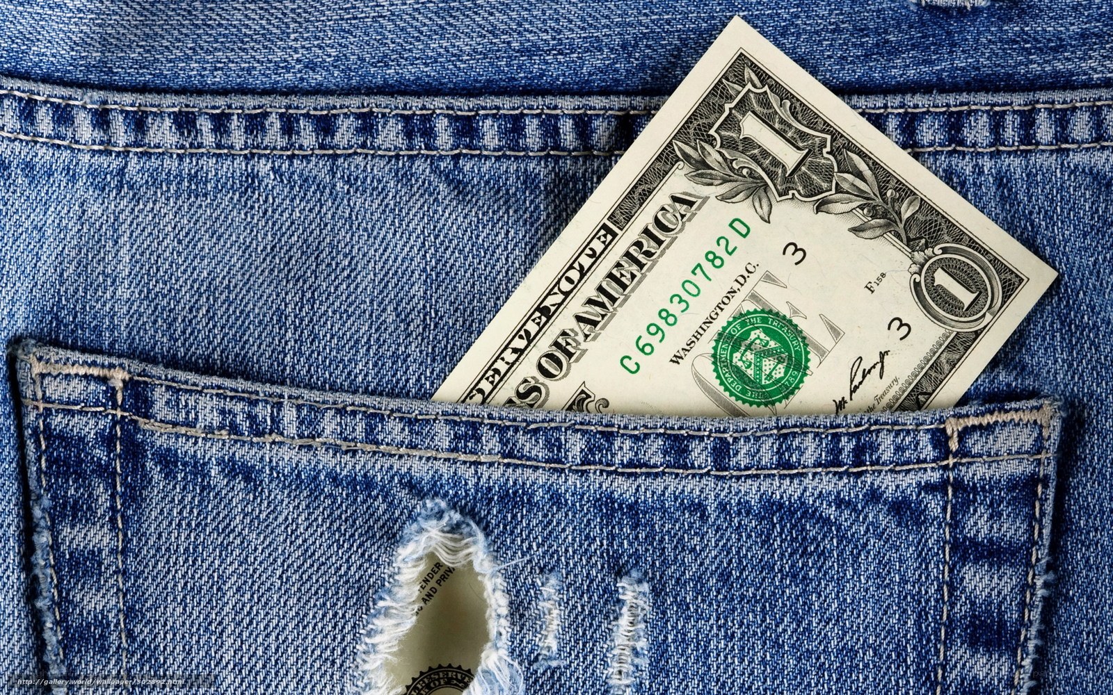 One dollar bill in jeans pocket