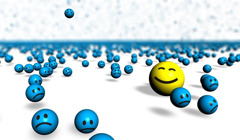 one happy face among sad faces