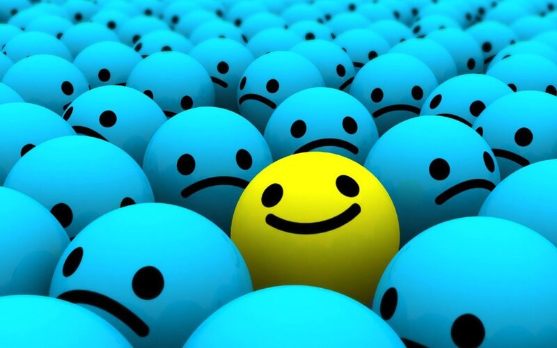 one happy face among sad ones