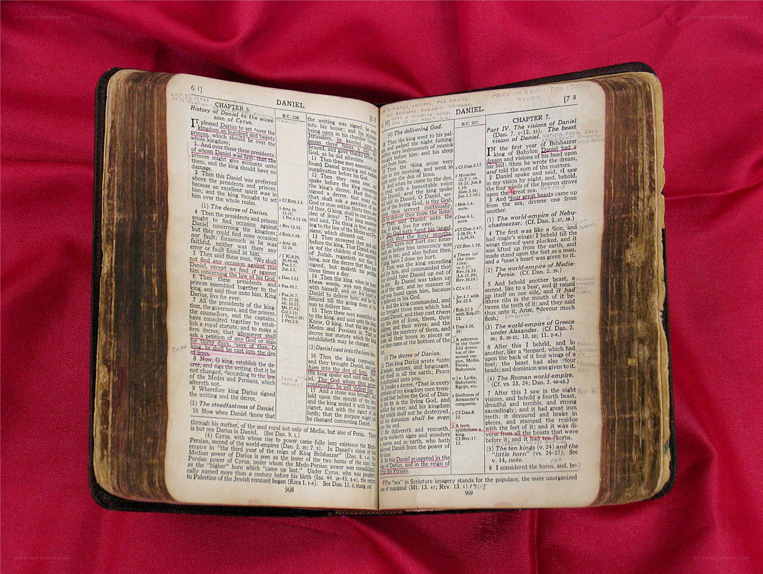 Open Bible on red fabric