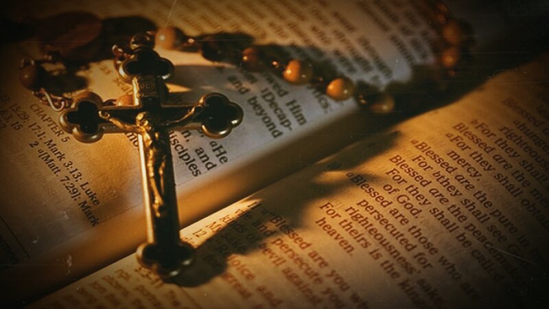 Open Bible with Rosary