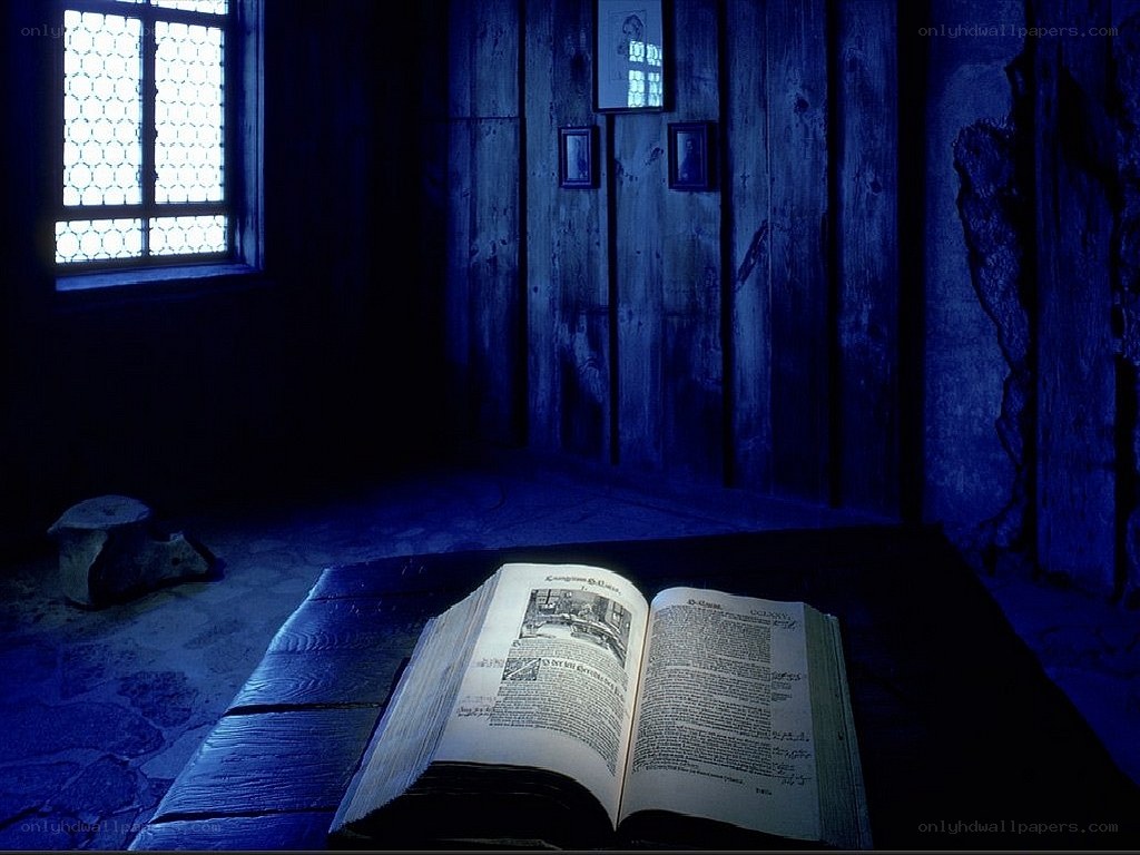Open book in a dim room