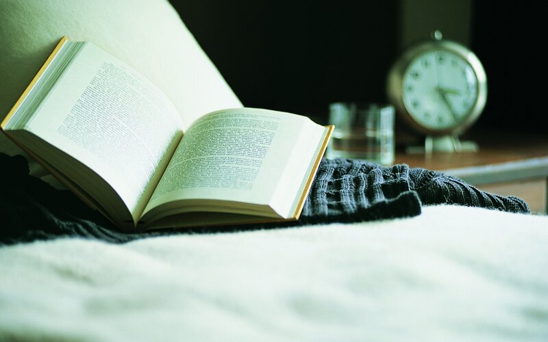 open book on a bed