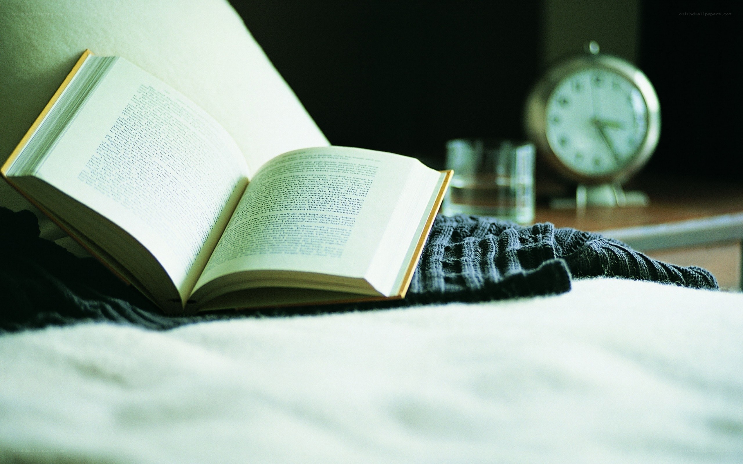 open book on a bed