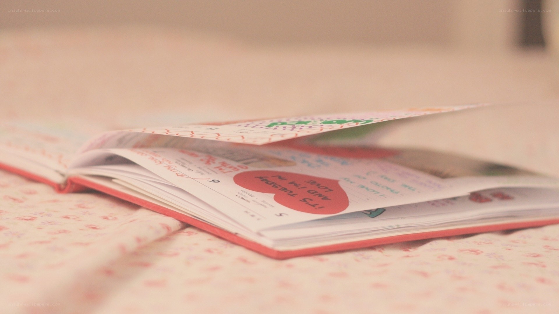 open book on floral fabric