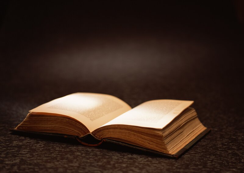 Open Book on Table — Dramatic