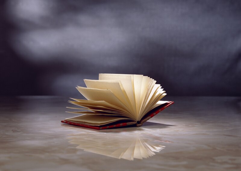 Open Book on Table — Gray