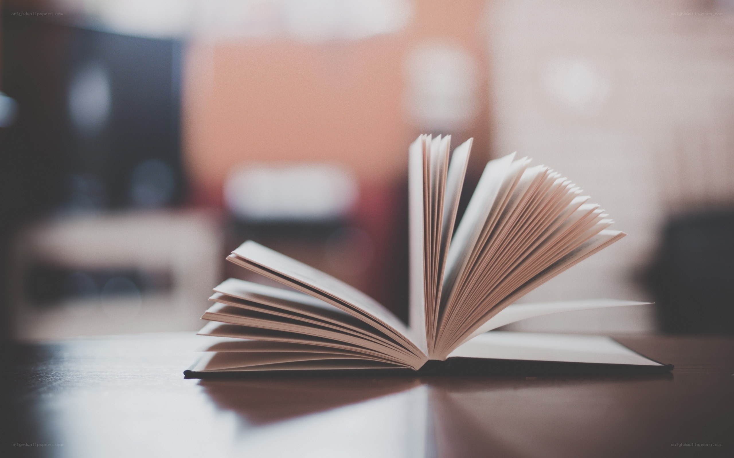 open book on wooden table