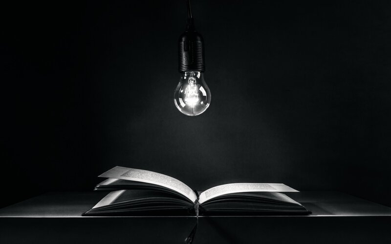Open Book under Light Bulb