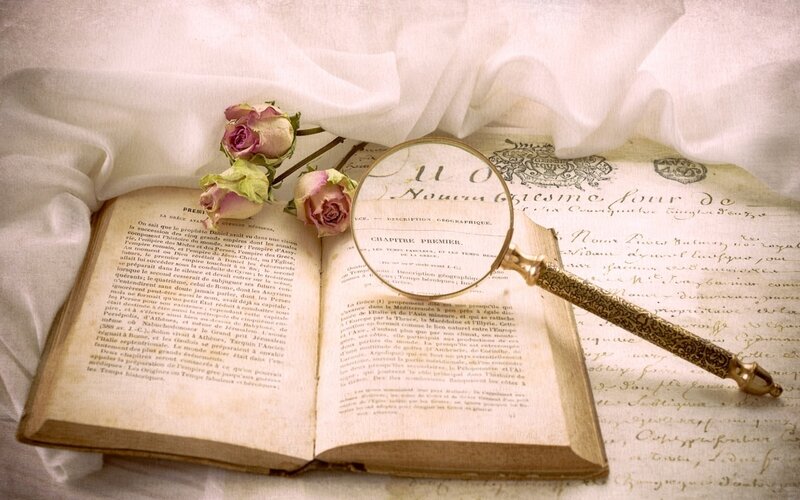 Open Book with Magnifying Glass