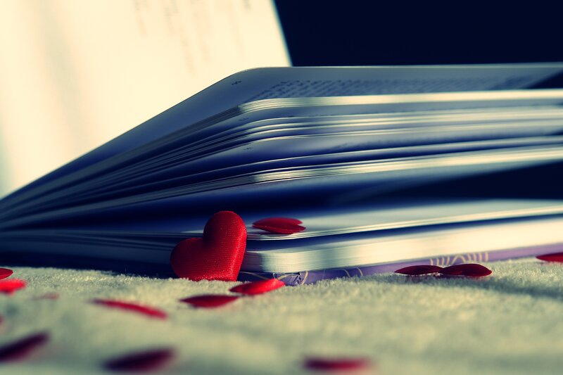 Open Book with Red Hearts