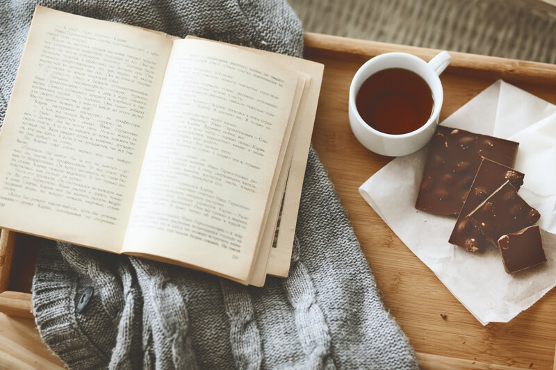 Open Book with Tea and Chocolate