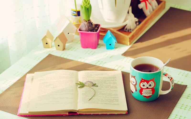 Open Book with Tea Cup
