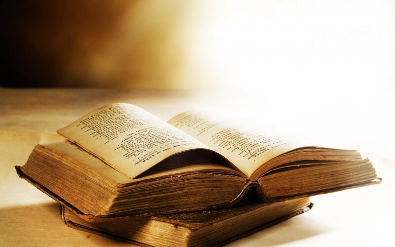 Open Books on Table