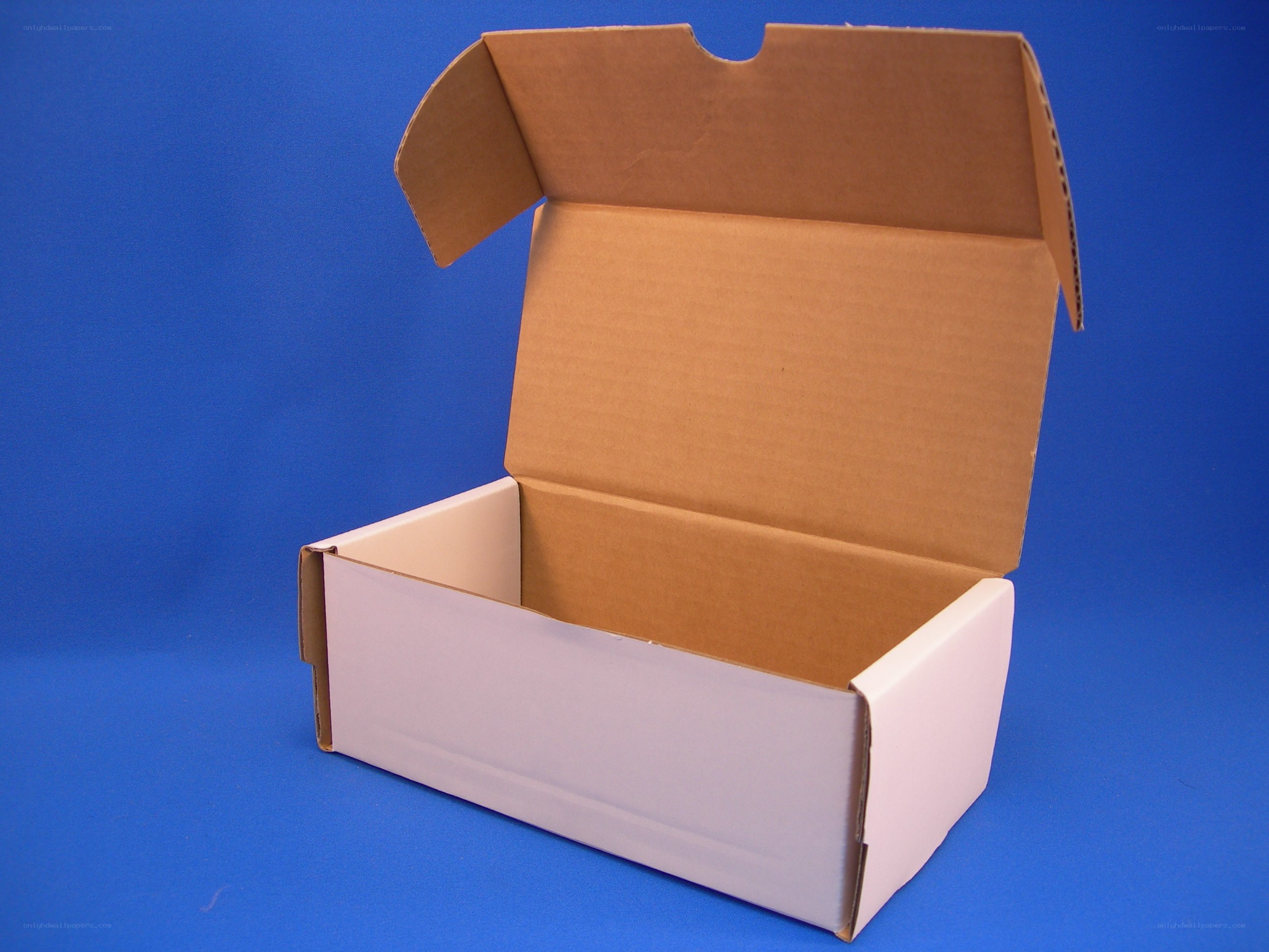 open cardboard box on blue