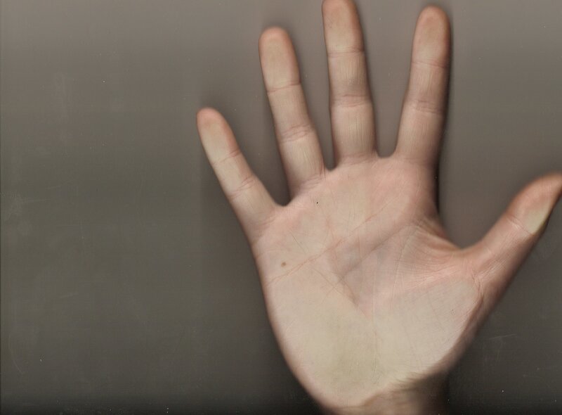 open hand on gray surface