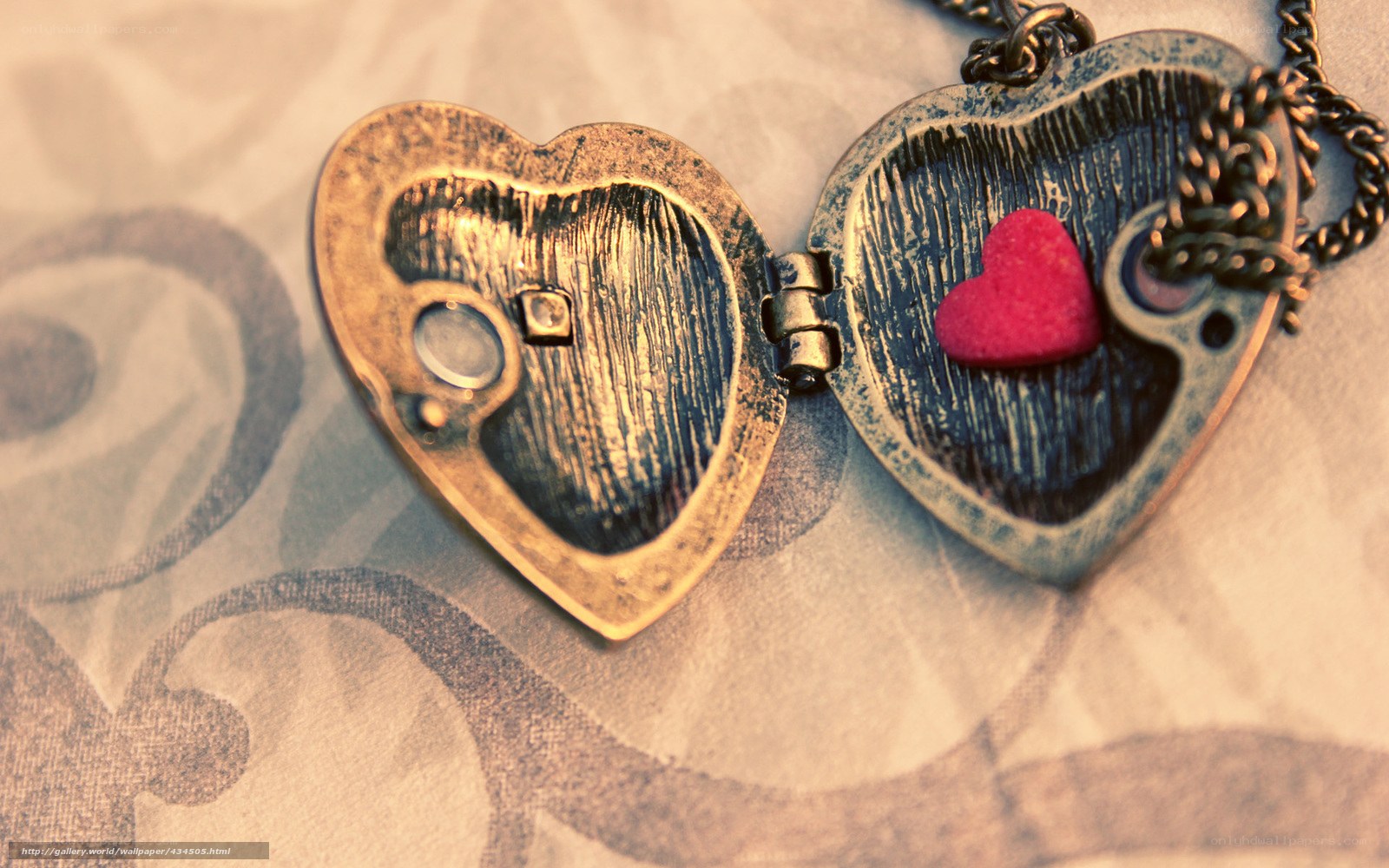 open heart locket with red heart