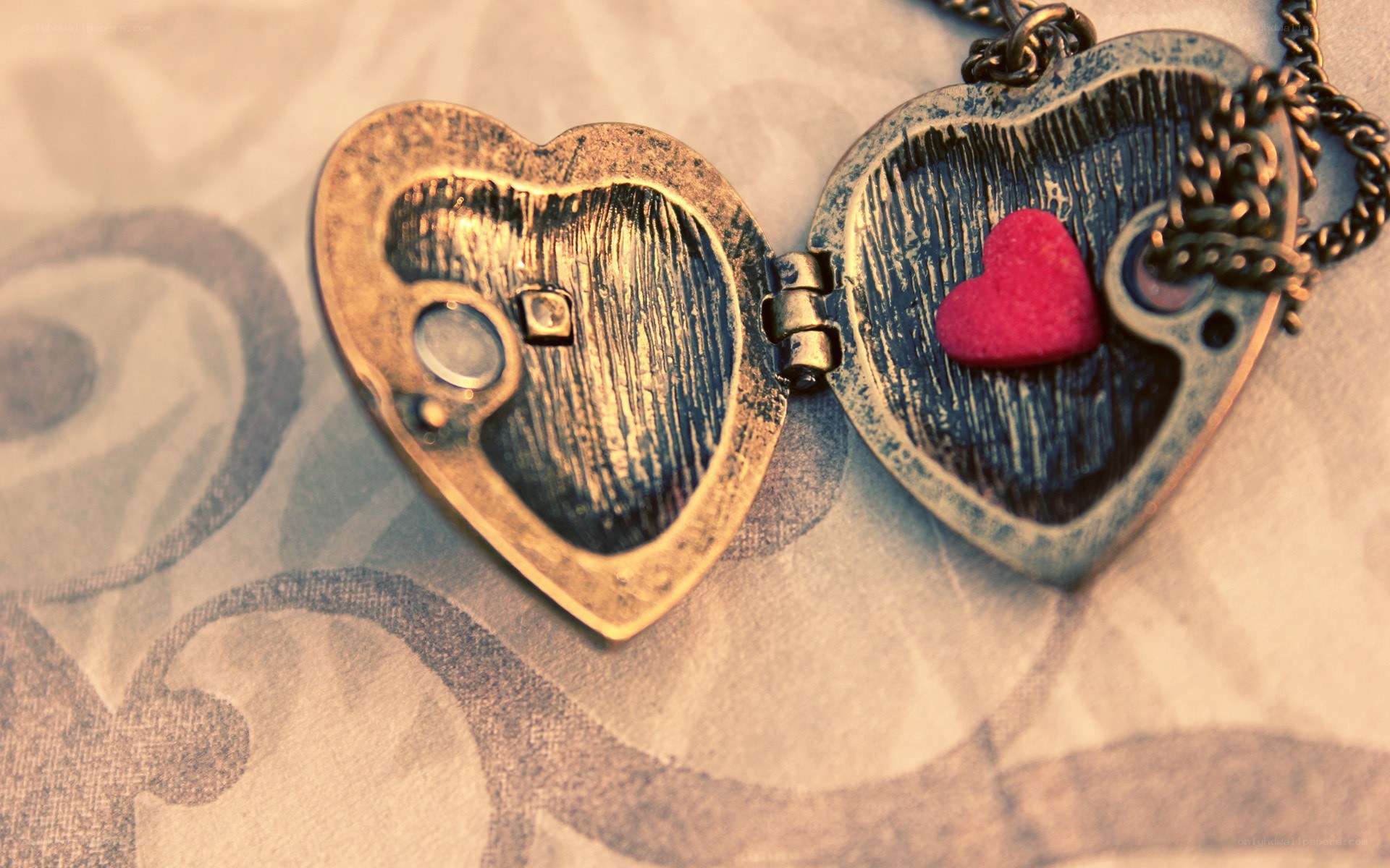 open heart locket with red heart