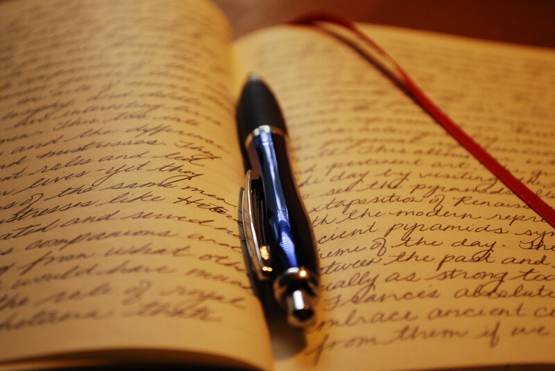 open journal with pen