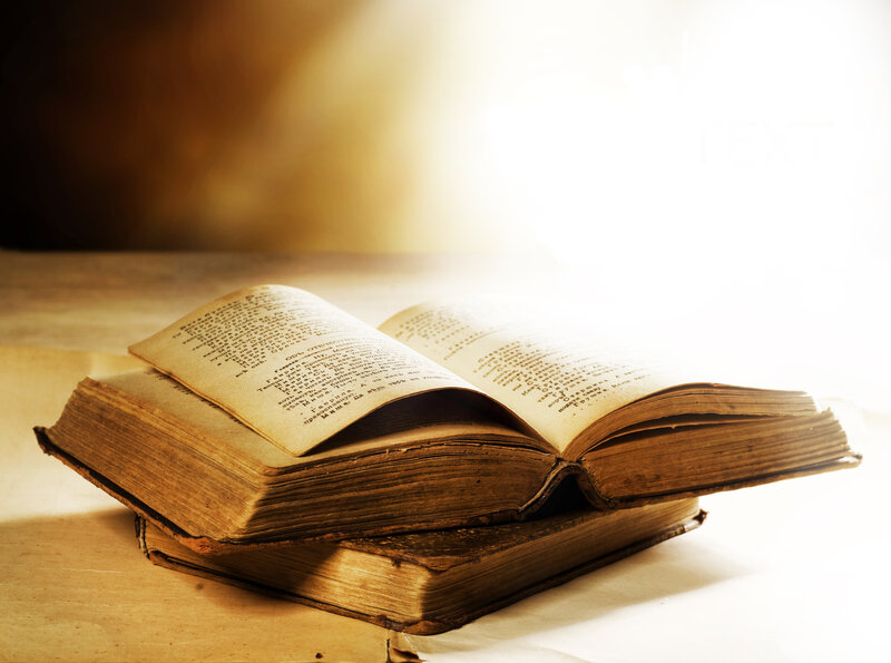 Open Old Books on Table
