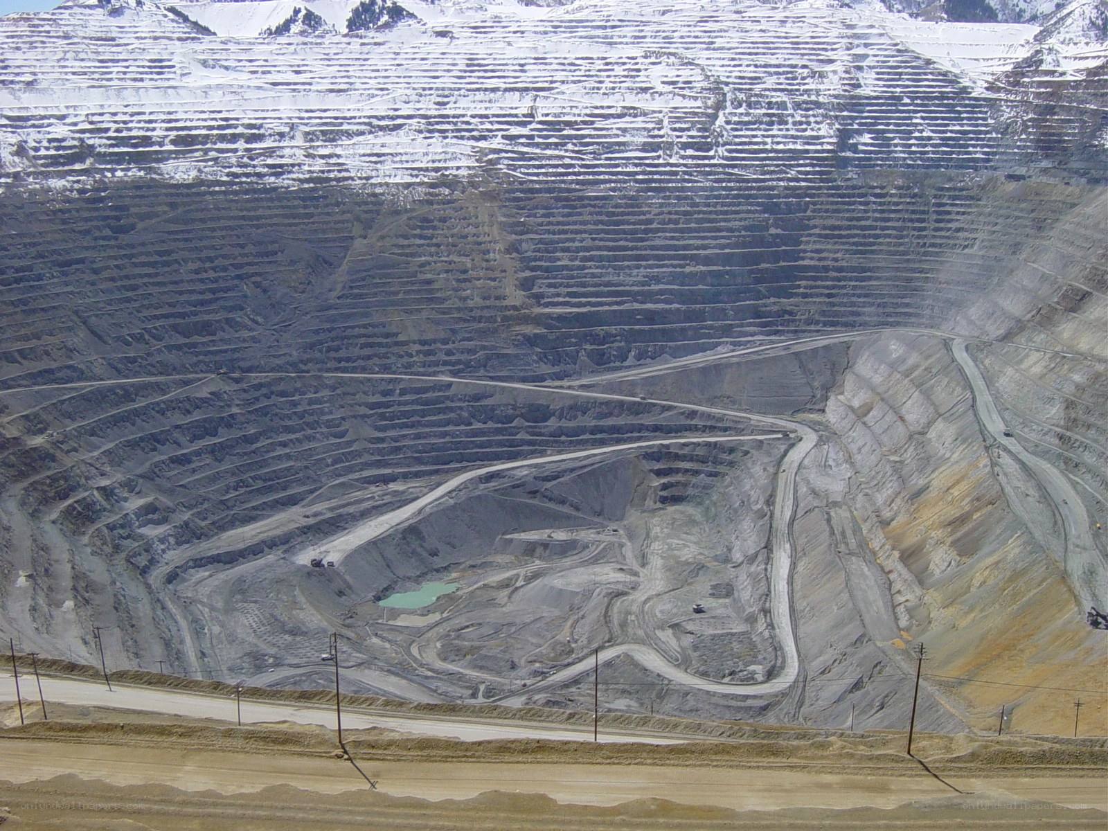 Open-pit mine in snowy mountains