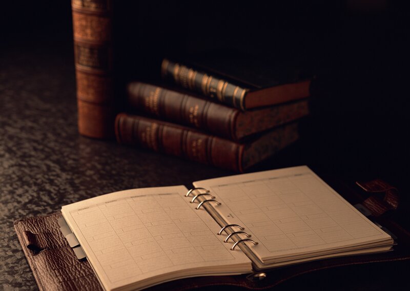 open planner with books