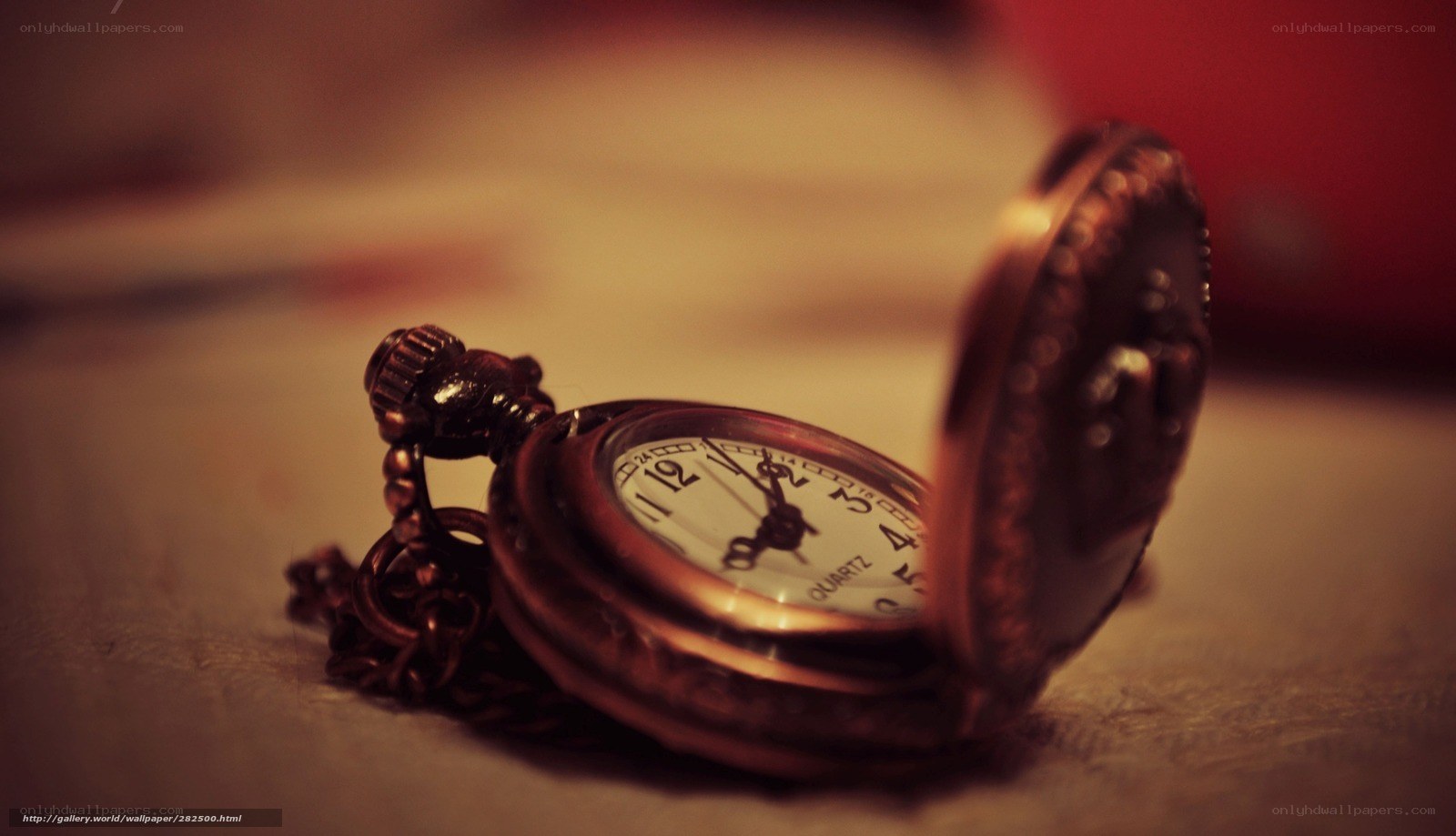 Open pocket watch on table