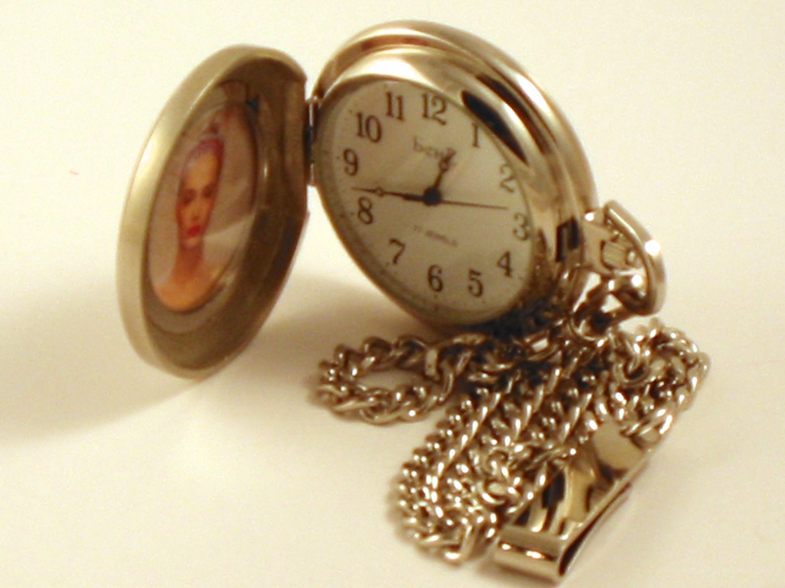 open pocket watch with photo