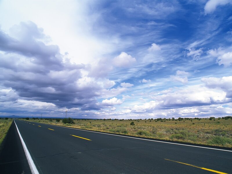 Open road under cloudy sky