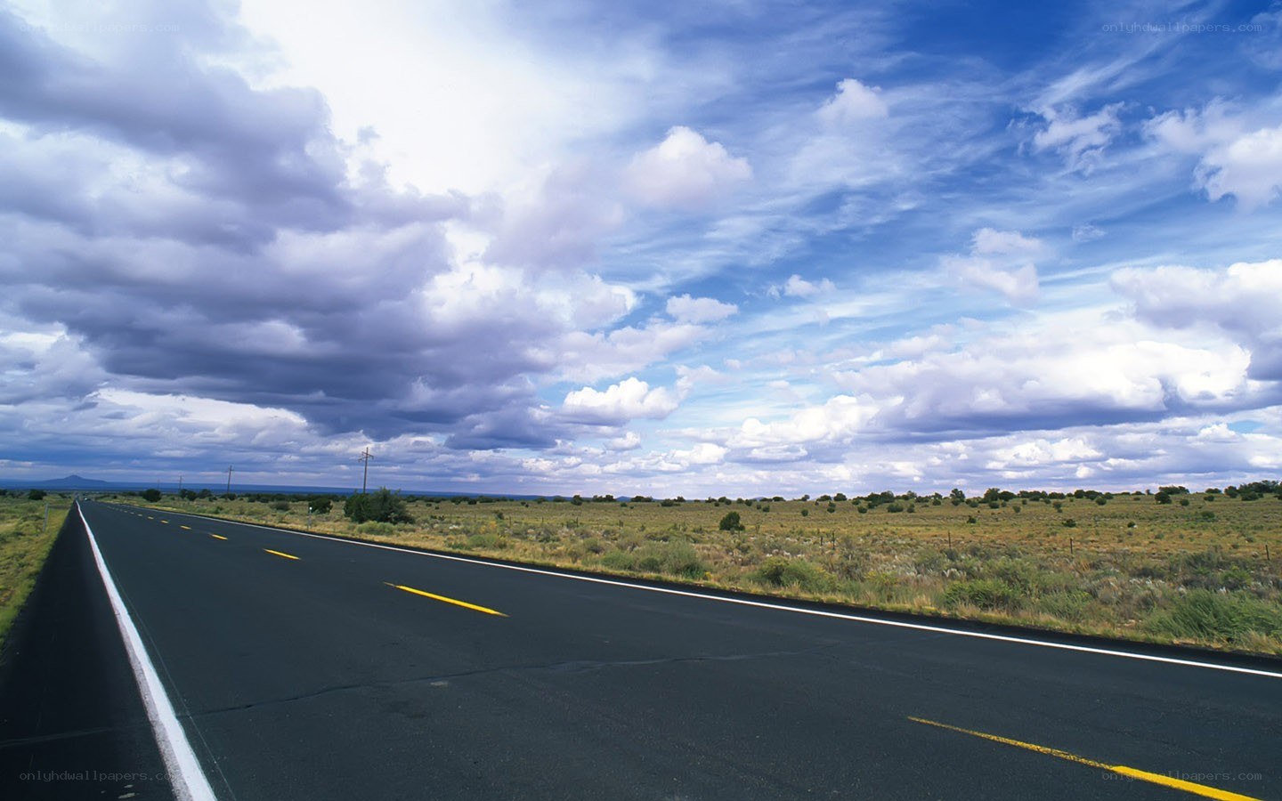 Open road under cloudy sky