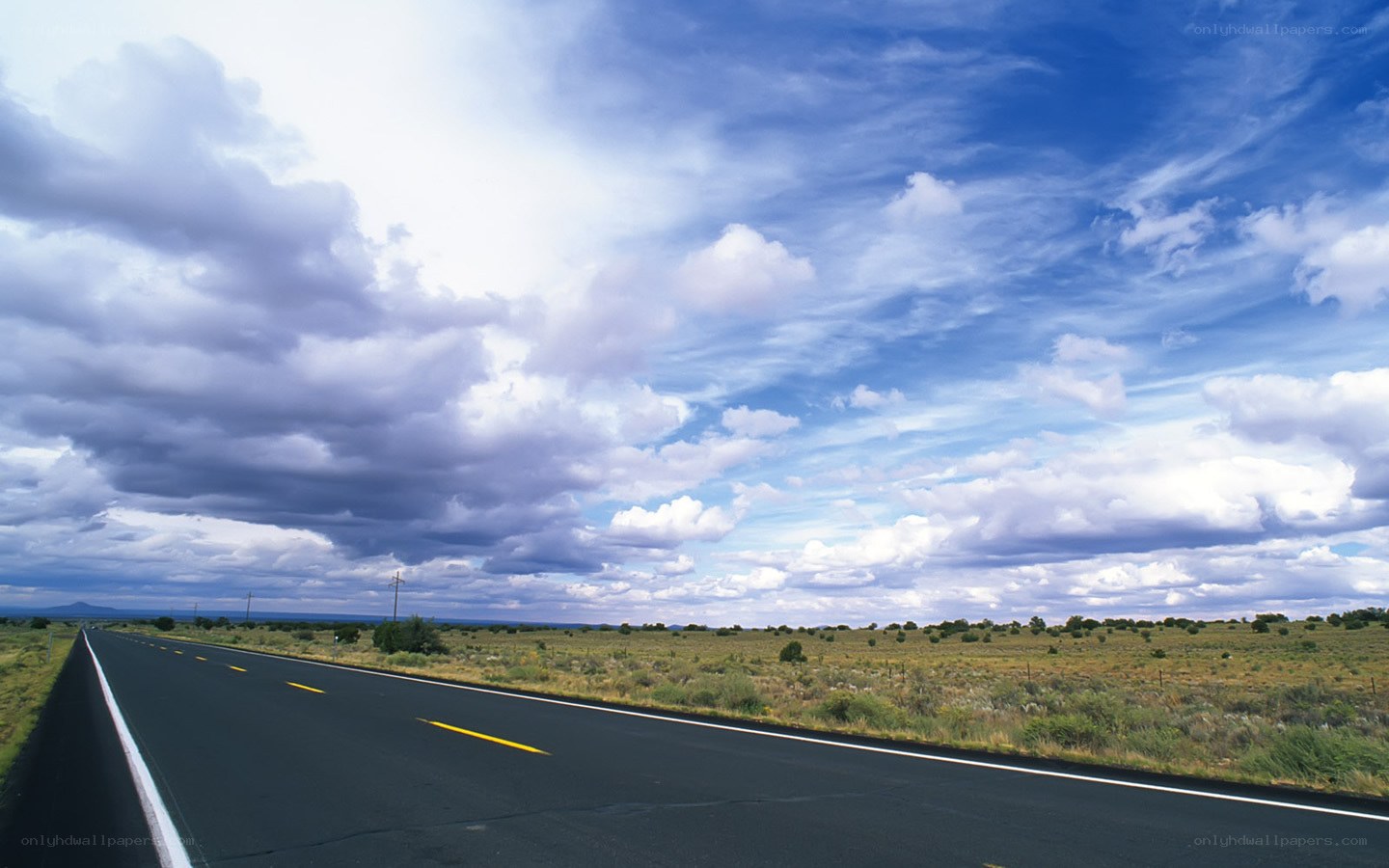 Open road under cloudy sky