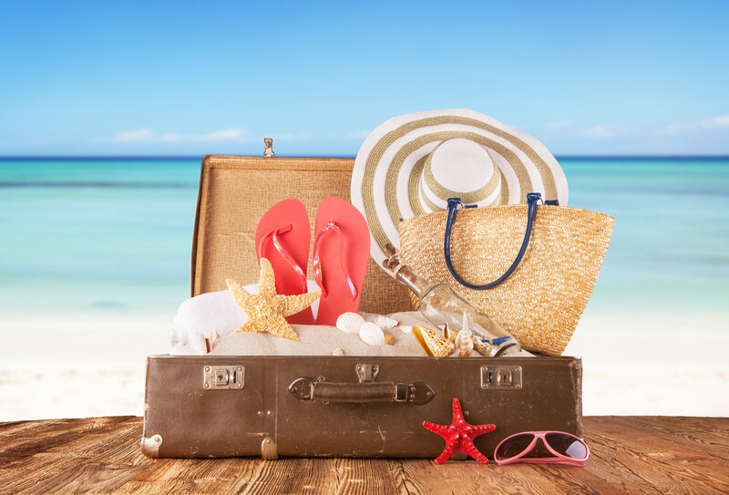 Open Suitcase on Beach — Blue