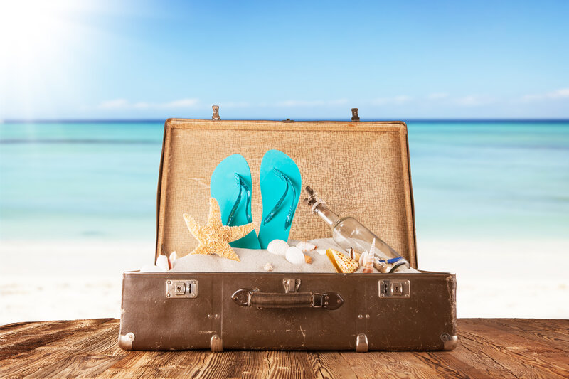 Open Suitcase on Beach — Brown