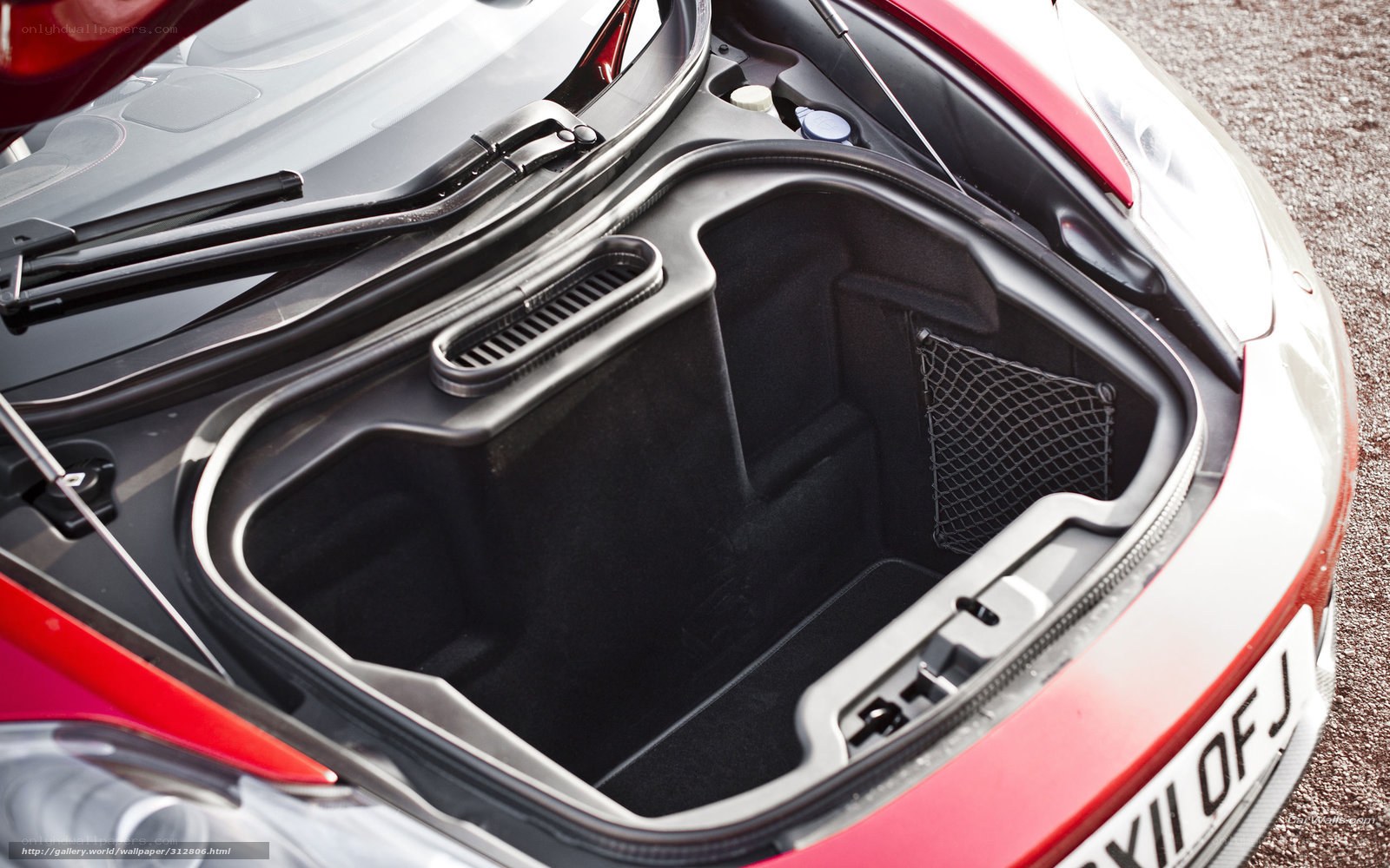 open trunk of red sports car