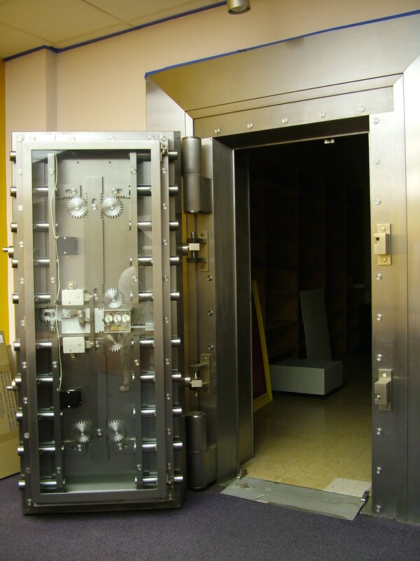 Open vault door in a secure room