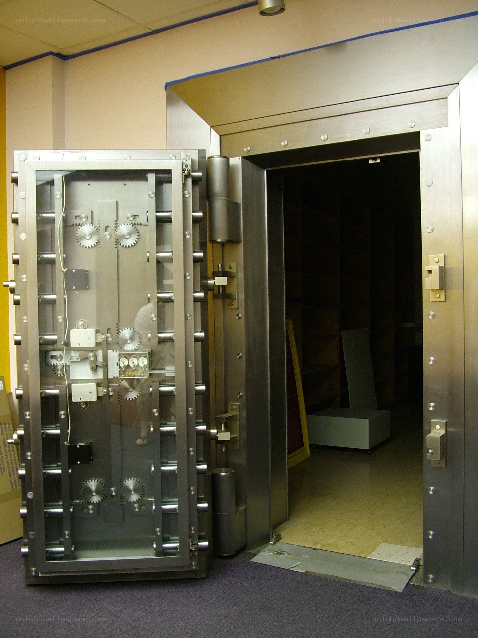 Open vault door in a secure room