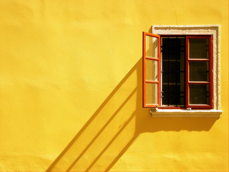 Open Window on Yellow Wall