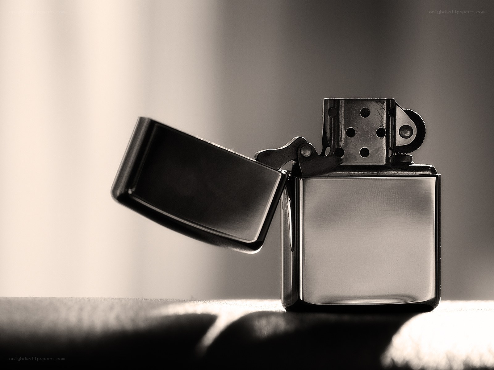 Open Zippo lighter in sepia