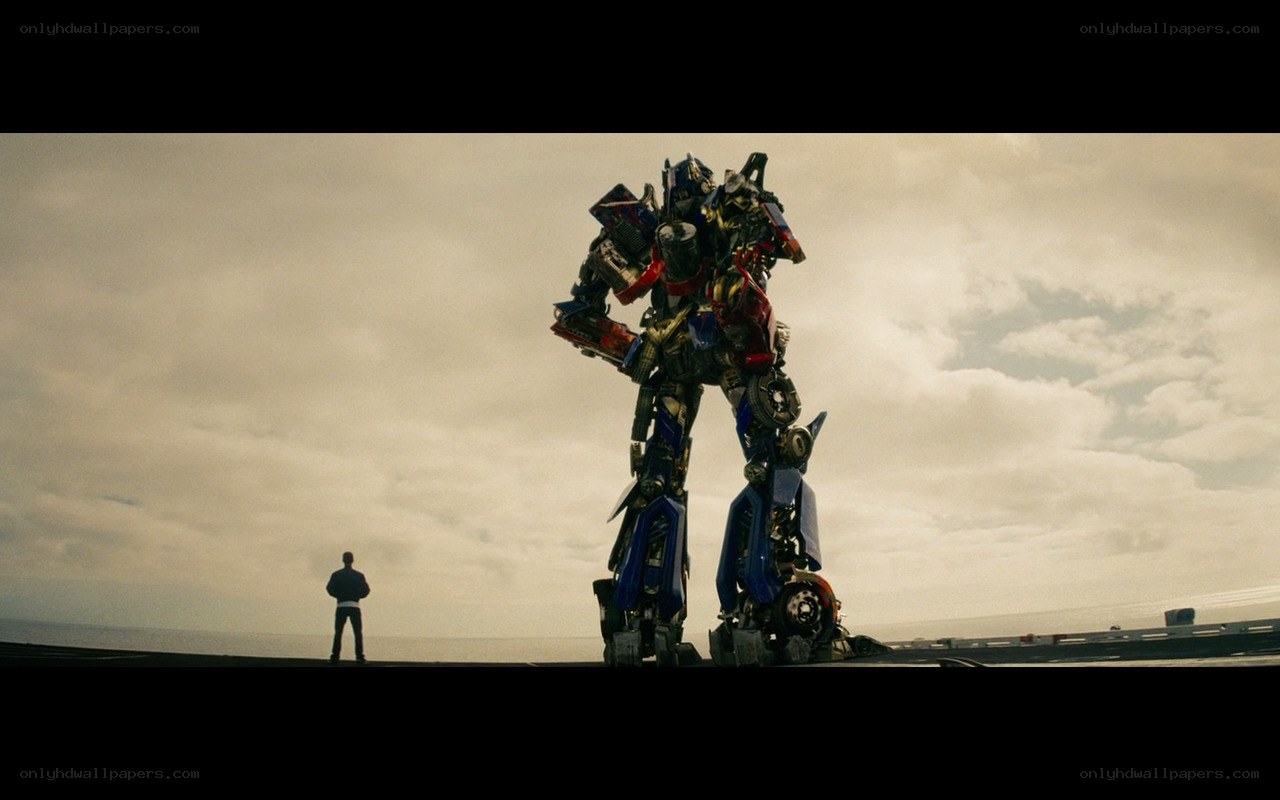 Optimus Prime stands on a bridge