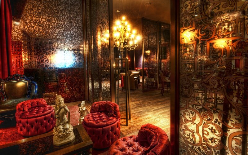 opulent lounge with red seating