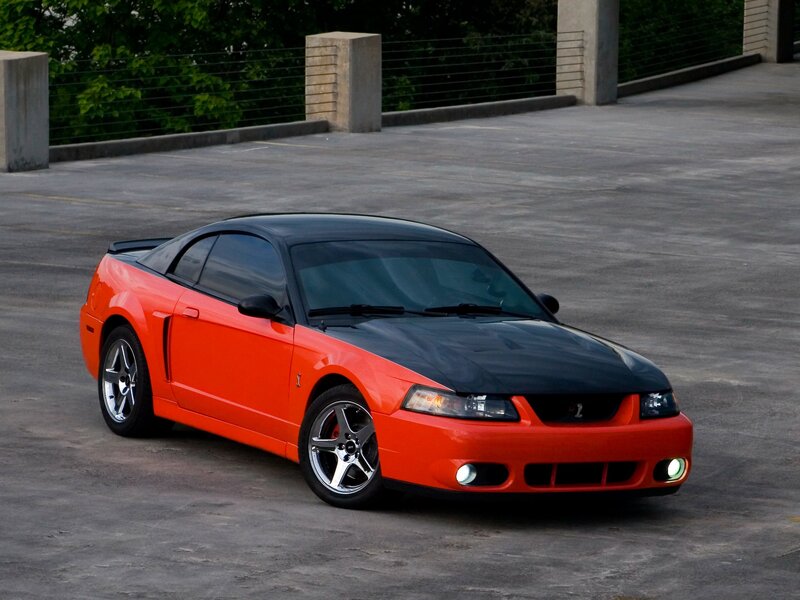 Orange and black Ford Mustang