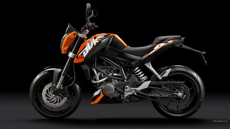 Orange and Black Motorcycle — Dramatic, Photograph, Black Background, Seat