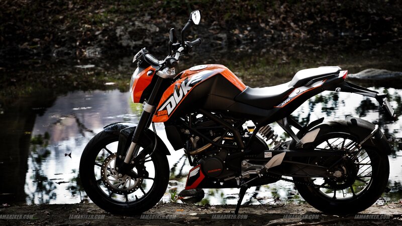 Orange and Black Motorcycle — Dramatic, Photograph, Pond