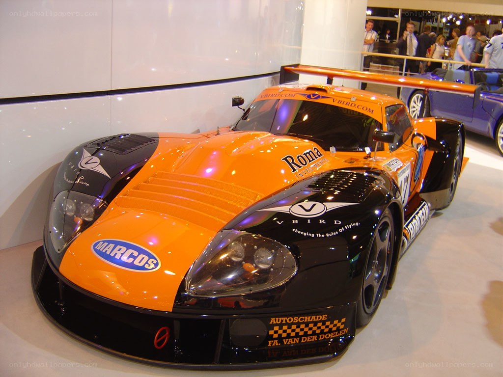 orange and black race car on display