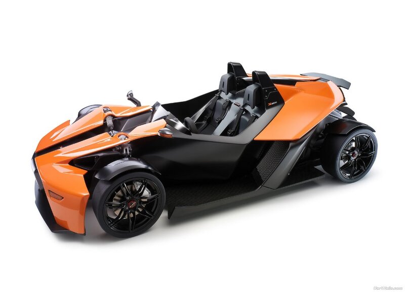 orange and black three-wheeled vehicle