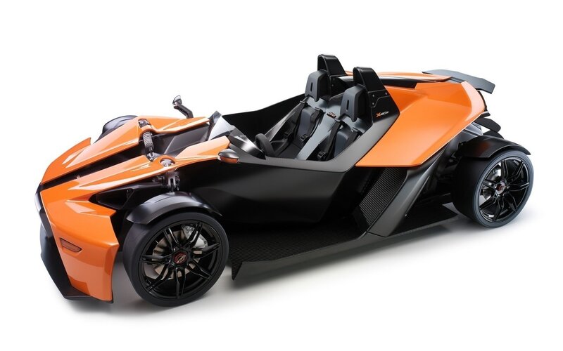 Orange and black three-wheeled vehicle