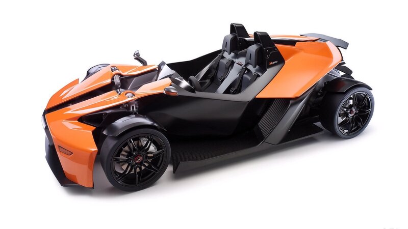 Orange and black three-wheeled vehicle